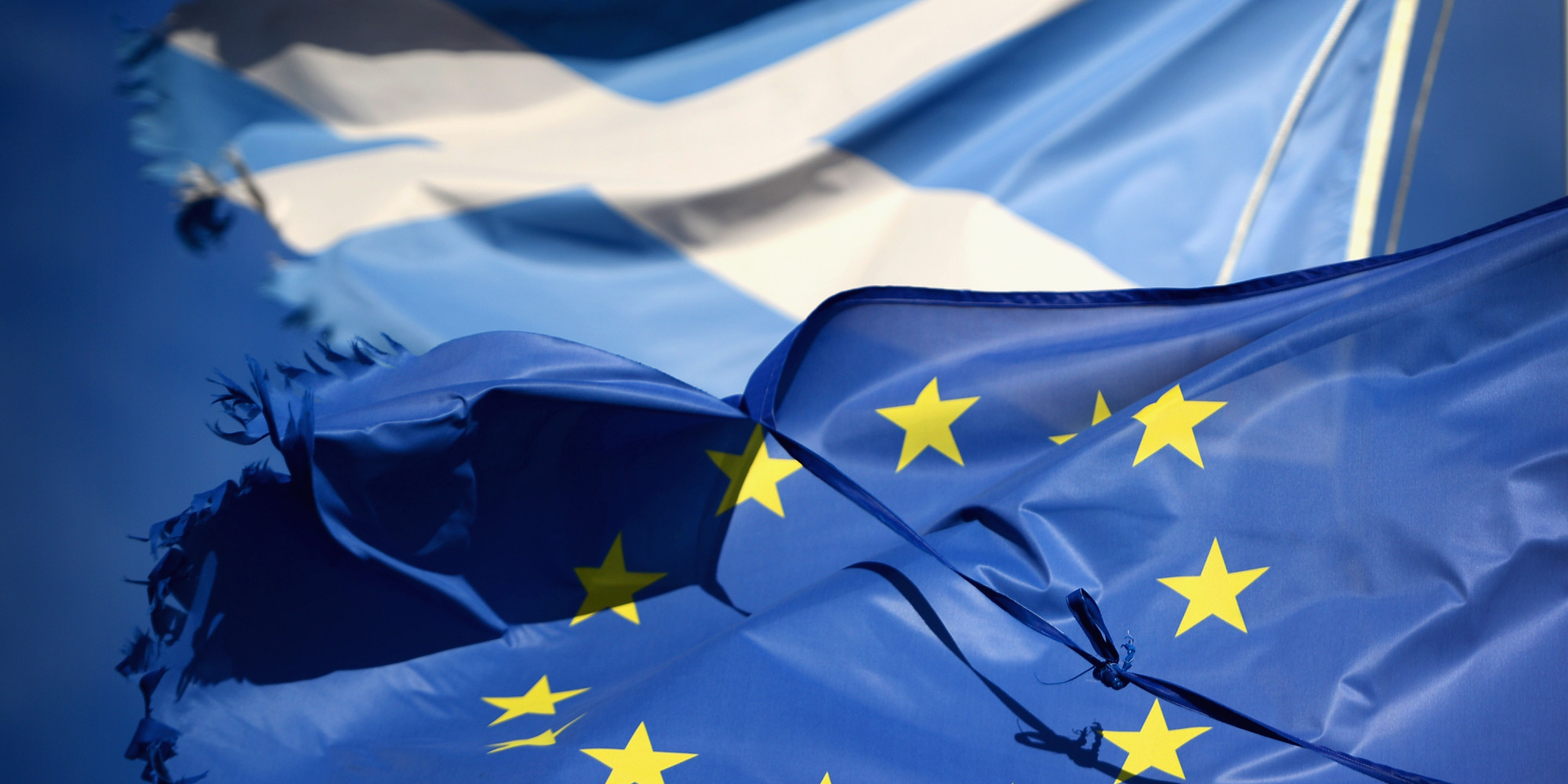 GLEN COE, SCOTLAND - MARCH 24: A European Union flag and Saltire flag blow in the wind near to Glen Coe on March 24, 2014 in Glen Coe, Scotland. A referendum on whether Scotland should be an independent country will take place on September 18, 2014. (Photo by Jeff J Mitchell/Getty Images)